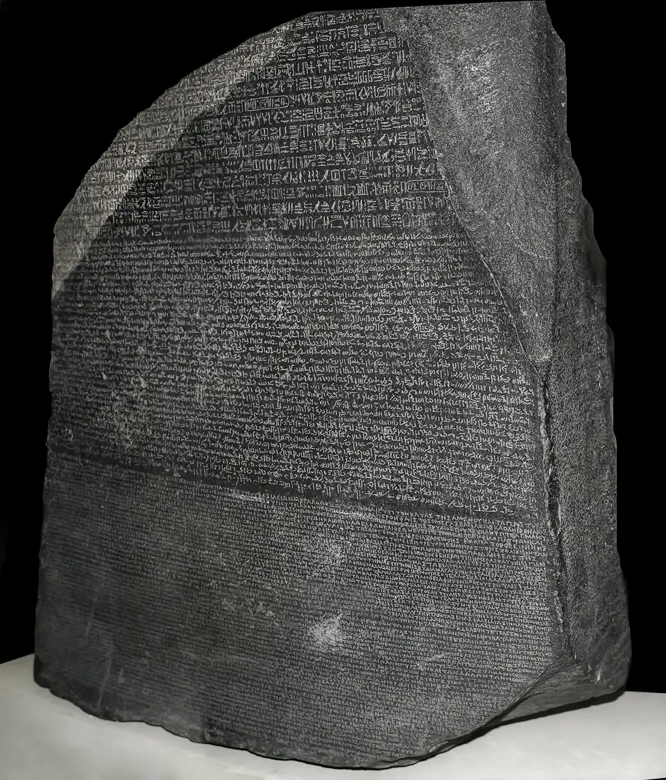 The front face of the Rosetta Stone with hieroglyphic text at the top, Demotic in the middle and Greek at the bottom